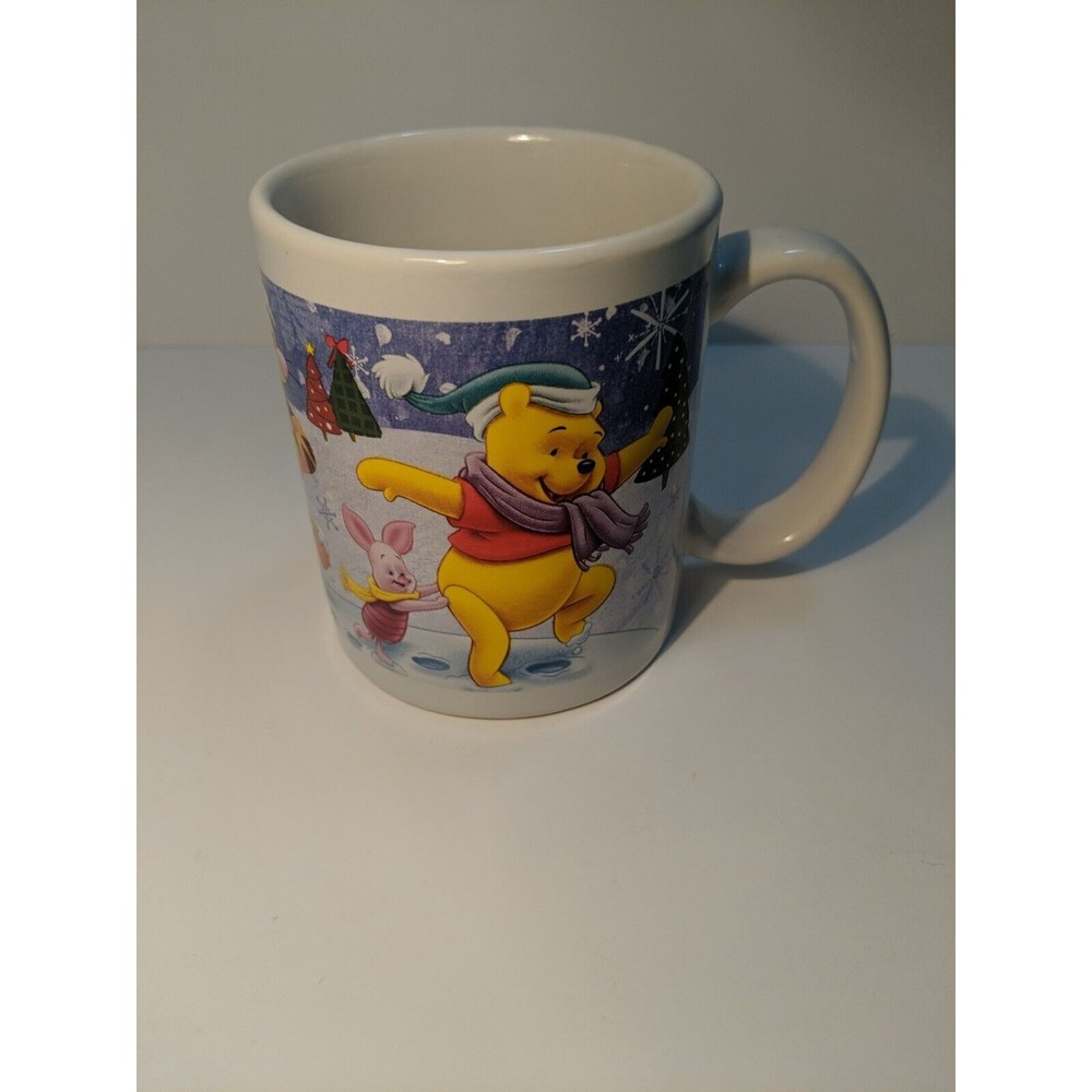 Winnie The Pooh Glass coffee mug. Playing in the snow.Disney Collectible mug